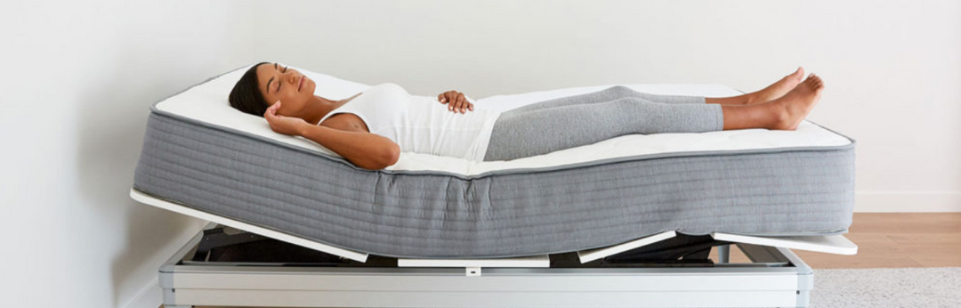 Individual sleeping comfortably on a adjustable bed 